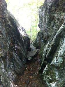 Back on the Appalachian trail you'll see a massive boulder split right down the middle. If you are claustrophobic I suggest you walk around.